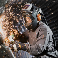 Man wearing PAPR powered air purifying respirators