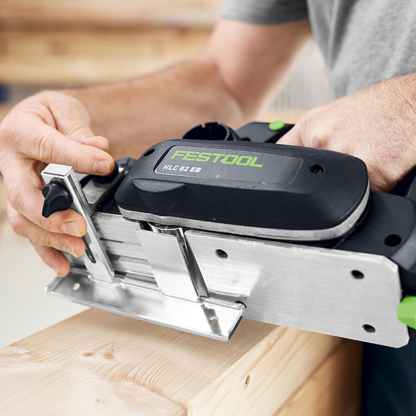 Festool HLC82 Cordless Planer being inspected by a workman