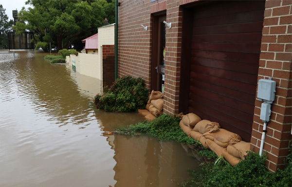 sandbags against a house to prevent flood damage